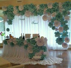 the table is set up with flowers on it