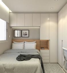 a bedroom with a bed, sink and toilet in it's corner area next to a window