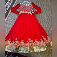 Beautiful Bright Red Color With Golden Color Detail Embroidery Worn Once Has A Light Stain But Other Than That It’s In Great Condition (See Video For Details) Final Sale No Returns Open To Offers Women’s Size Small One Piece Long Anarkali Red Anarkali Set For Festive Season, Red Semi-stitched Anarkali Set For Festive Occasions, Red Bollywood Anarkali Set With Traditional Drape, Red Anarkali Traditional Wear For Festive Occasions, Traditional Drape Red Anarkali Set With Dabka Work, Red Semi-stitched Anarkali Set For Eid, Red Anarkali Set For Eid Festivities, Red Anarkali Set For Eid Festival, Red Festive Anarkali Set For Eid