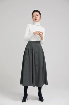 dark grey elegant wool pleated skirt with button 2246 – xiaolizi Gray Skirt Outfit Work, Elegant High Waist Gray Skirt, Gray High Waist Skirt For Work, Gray Flared Skirt For Fall, Gray Midi Skirt For Work, Elegant Pleated Skirt With Buttons For Work, Fall Wide Leg Skirt With Buttons, Gray Full Skirt For Work, Gray Full Skirt For Workwear