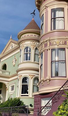 an ornate victorian style house on a sunny day