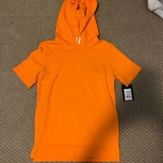 Orange Hoodie Shirt Brand New With Tags Never Worn Basic Hooded Top For Spring, Spring Sports Tops With Adjustable Hood, Casual Orange Hooded Top, Orange Hooded Top For Streetwear, Sporty Orange Hooded Top, Orange Cotton Hoodie Top, Casual Orange Hoodie, Orange Hooded Sporty Top, Orange Cotton Hooded Top