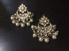 *It's Handmade Indian Ethnic Kundan Chandbali Earrings with white kundan and Pearl drop. *It's made from Silver n Copper with White Kundan Stones Settings with 22k gold Plating as shown in picture. *It it Pure Ethnic Look with Antique Touch and 1.8 inch size. *Our all jewelry is made from semiprecious stones and beads. *WARRANTY: ITS GENUINE HANDMADE JEWELRY AND WE ARE GIVING LONG LIFE WARRANTY FOR OUR ALL ITEMS. All of our Kundan Jewelry is 100% handmade with ancient Kundan stone setting method Kundan Chandbali, Chand Bali, Bali Jewelry, Gold Chandelier Earrings, Kundan Jewelry, Heritage Jewellery, Chandbali Earrings, Indian Jewellery Design Earrings, Antique Jewelry Indian