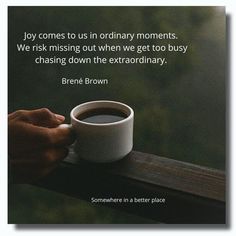 someone is holding a cup of coffee with a quote on the front and back side