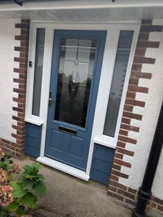 a blue front door on a brick house