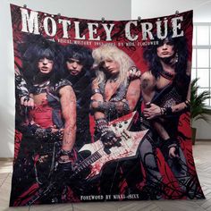 the band motley crue posing with their guitars