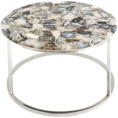 a white and black stone table with metal legs