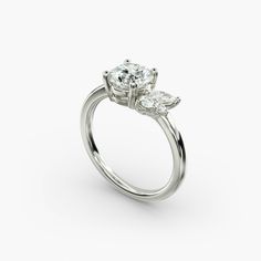 an engagement ring with two pear shaped diamonds