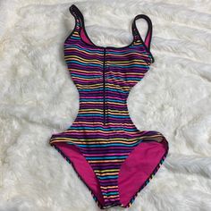 Nwot. Excellent Condition. One Piece Multi Color Striped Zipper Backless Swimsuit Jrs. Size M Purple Lined Bodysuit For Pool, Summer Swimming Bodysuit In Purple, Summer Purple Swimming Bodysuit, Purple One-piece Swimming Bodysuit, Purple One-piece Bodysuit For Swimming, Purple Bodysuit For Swimming, Beach Season, Purple Bodysuit For Swimming Beach Season, Purple Beach Season Bodysuit For Swimming, Backless Swimsuit