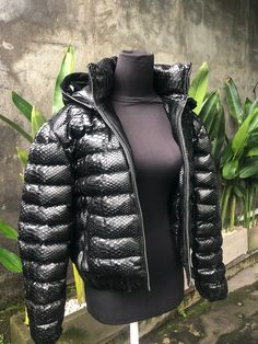 Snakeskin DUCK DOWN Jacket. A jacket made from genuine python leather. Removable hood. Outside: GENUINE PYTHON LEATHER Inside: DUCK DOWN 100% Accessories: silver color (please see the photo). Lining: MONCLER All our products are 100% handmade, we always try to create interesting ideas to make your style unique. We use only the highest quality materials and accessories from around the world and only best leather from Indonesia. Before listing each new model undergoes different quality and usabili Luxury Black Puffer Jacket With Zipper Closure, Black Luxury Puffer Jacket With Double-lined Hood, Luxury Black Puffer Jacket With Double-lined Hood, Luxury Hooded Puffer Jacket With Zipper Closure, Luxury Puffer Jacket For Outdoor Fall Use, Luxury Puffer Jacket For Fall Outdoor, Luxury Hooded Puffer Jacket For Streetwear, Luxury Black Hooded Puffer Jacket, Long Sleeve Snake Print Winter Outerwear