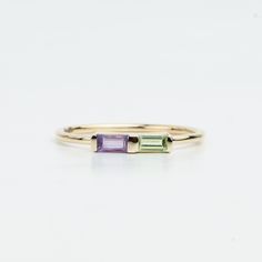 Amethyst & Peridot Baguette Ring - Dual Baguette Stackable Ring, Birthstone Dainty Ring, Elegant August & February Gift" Description: This elegant dual baguette ring features stunning amethyst and peridot stones, perfect for stacking. A dainty and versatile piece, it's an ideal birthstone ring for August and February birthdays or a thoughtful gift for someone special. Same design can be made also with other custom gemstones per request.  Similar Designs in other gemstones are - Product details: Modern Birthstone Ring With Baguette Cut, Modern Baguette Rings Suitable For Gifts, Modern Baguette Cut Birthstone Rings, Modern Stackable Emerald Cut Gemstone Rings, Modern Multi-stone Baguette Cut Rings, Classic 14k Gold Baguette Cut Birthstone Ring, Peridot Baguette Ring, Minimalist Birthstone Ring With Baguette Cut Gemstone, Elegant Birthstone Baguette-cut Jewelry