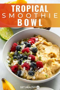 tropical smoothie bowl with berries and bananas in it