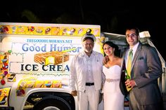 two men and a woman standing in front of an ice cream truck with the words good humor written on it