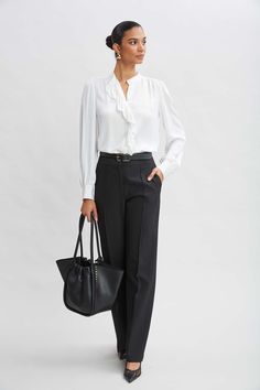 Meet the pant of the season! Our wide leg Fluid Crepe Pant features a high-rise waist, pintuck details and side zip closure. We love these pants worn with its matching double-breasted blazer or with luxe silk satin or knits.   Elie Tahari Exclusive  Wide Leg Pant  71% Polyester, 21% Viscose, 8% Elastane  Runs true to Size  Model is 5'9" and wearing size 2  Measurements: Front Rise: 12"L, Inseam: 33.5'L (approx. length for size 6)  Dry Clean Only  Imported  Style #: E9011204 Jumpsuit Jacket, Long Sleeve Short Dress, Elie Tahari, Wide Leg Pant, Breasted Blazer, Knit Tees, Denim Coat, Knit Jacket, Cardigan Jacket