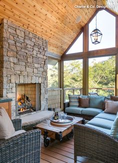 a living room filled with furniture and a fire place