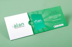 a green and white business card with the word atlasn on it's side