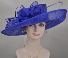 "https://www.youtube.com/shorts/0SWUprbeWfw With my little son's help, I finished the video on Youtube, it is very hard for the people to get a right size hat due to the big head size, please check the video, it will help you. Description: This beautiful sinamay hat is an elegant wear at any church or derby event. its sinamay material is not too intimidating and attracts the eye. The chic flower adnorment that rests on the wide, side sweep brim is complemented by sinamay accentuations. Material: Royal Blue Fitted Hat For Kentucky Derby, Elegant Royal Blue Fascinator For Races, Elegant Royal Blue Fascinator For Formal Occasions, Royal Blue Hats For Evening At Royal Ascot, Fitted Royal Blue Hat With Short Brim, Evening Royal Blue Hat With Curved Brim, Royal Blue Fitted Hat For Party, Fitted Royal Blue Hat For Evening, Elegant Royal Blue Hat For Royal Ascot