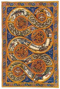 an intricately decorated book with swirls and scrolls