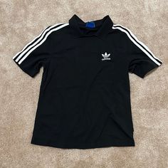 Never Worn Classic Crew Neck Top With Three Stripes, Adidas Short Sleeve Tops With Three Stripes, Classic Adidas Cotton Tops, Classic Streetwear Tops With Three Stripes Branding, Classic Three Stripes Tops For Streetwear, Classic Tops With Three Stripes Branding For Streetwear, Basic Adidas Tops With Three Stripes, Classic Adidas Short Sleeve Tops, Casual Black T-shirt With Three Stripes