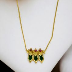 Elegant Gold Plated Green Nagapadam Pendant Necklace for girls. This stunning necklace features a thin chain with three Nagapadam pendants adorned with rubies. It is perfect to wear with ethnic outfits on festive and marriage occasions, and makes for a great gift for girls. For a complete ethnic look, you can pair it with Nagapadam studs and bangle. Mangalsutra Chain, Dance Earrings, Mens Silver Jewelry, Dance Necklace, Bridal Jewelry Collection, Gold Plated Bangles