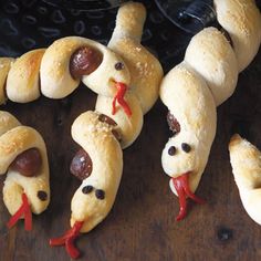 some hotdogs wrapped in bread are sitting on a table