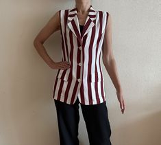 "Choice by Steilmann Vintage Blouse White Red Striped Vest Sleeveless Women Summer Shirt  Shown on model S Measurements (lying flat): Length: 28\"/ 71 cm Shoulder: 15\"/ 38 cm Pit to pit: 19\"/ 48 cm Waist: 16 3/4\"/ 42.5 cm Condition: Good Vintage Condition N.B. Color may slightly differ from picture Please check measurements to insure a proper fit. Remember to allow yourself some extra room for movement. You can compare these with something from your closet that fits you well. Please convo me if you need additional measurements. SHIPPING * I ship worldwide via Priority mail  * Items are shipped 1- 3 business days after receiving the payment. * I ship from Europe, so please allow 2 to 4 weeks for the package to arrive if you live overseas. * Europe 5 - 10 business days. 939 PRO" Retro Red Sleeveless Tank Top, Retro Red Sleeveless Vest, Red Sleeveless Retro Vest, Red Sleeveless Blouse For Work, Vintage Summer Vest For Workwear, Retro Sleeveless Vest For Work, White Denim Vest, Striped Vests, Knit Vest