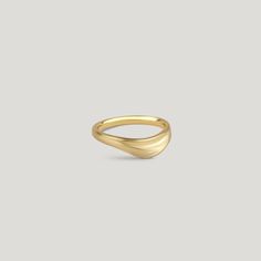 The Curved Dune Ring - an organic silhouette inspired by the ever-changing formations found in coastal landscapes created by strong wind and flowing water. A celebration of the delicate interplay between nature and art, where the rhythmic curves and intricate details pay homage to the wonders of elemental forces. Certified recycled 14k yellow gold Light matte finish Tapered band approximately 2.7mm wide at the bottom and 5.5mm wide at the top Slightly curved to stack with other rings Dune Series, Line Jewelry, Flowing Water, Handmade Fine Jewelry, Meaningful Jewelry, Coastal Landscape, Strong Wind, Gold Light, The Dunes