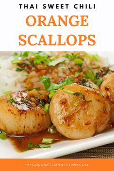 orange scallops on a plate with white rice and garnished green onions