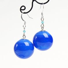 "These Blue ball dangle earrings are good for everyday outfits and for special occasions. They can be a great gift for her! Dimensions: total length is 2\" inch (5cm), ball diameter 0.9\" inch (2.2cm). Materials: artist lampwork glass beads, silver plated hooks. Colors used: blue. For your information: ✦ Get free shipping when you buy any two or more items! ✦ All jewelry is shipped with some kind of gift wrapping, box or bag depending on size. ✦ Your order will be packed very carefully and will Trendy Light Blue Drop Earrings, Trendy Light Blue Dangle Earrings, Trendy Blue Dangle Earrings, Trendy Blue Round Bead Earrings, Blue Hypoallergenic Earrings, Hypoallergenic Blue Earrings, Blue Dangle Earrings With French Hook, Minimalist Blue Earrings With Ear Wire, Light Blue Hypoallergenic Drop Earrings