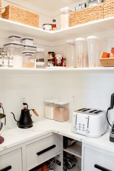 the kitchen is organized and ready to be used as a storage area for food items