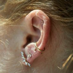 Oh look! The tiniest fairy wings have perched upon your earlobe! Set with the tiniest diamond for extra sparkle. Sold as singles. See Details for item specifics. Delicate Single Cartilage Earring, Dainty Single Ear Climber For Parties, Dainty Single Cartilage Earring For Party, Laurie Fleming, Tiny Diamond, Fairy Wings, Sell Gold, Mother Pearl, Gold Collection