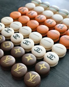 many different types of chocolate candies with letters and symbols on them, all arranged in the same row