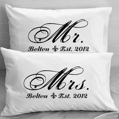 two personalized pillows with the names mr and mrs in black ink on white linen