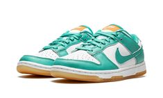 The Women’s Nike Dunk Low “Teal Zeal” is a women’s-exclusive colorway of the vintage basketball and lifestyle shoe that was released in July 2022.  A summer-ready colorway, the “Teal Zeal” features an appealing combination of white leather on its base, and Teal Zeal-colored leather on its overlays and Swoosh branding.  A white “Nike” logo is embroidered on the heel.  An orange tongue tag with “Nike Dunk” branding contrasts the look of the white tongue.  Teal Zeal laces continue the shoe’s bold s Womens Dunk Low, Nike Dunk Lows, White Tongue, Dunk Lows, Teal Nikes, Low Dunks, July 2022, Stadium Goods, White Turquoise