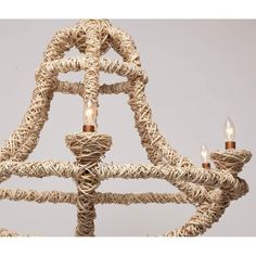 a chandelier made out of rope with three lights