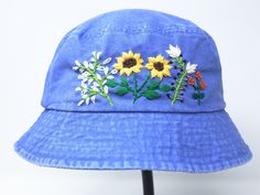 Item: flower embroidered bucket hat Material: 100% cotton Size: one size fits most Color: white, message me if you want to customize the pattern to another color Free first class shipping, upgradable priority mail service. 30 days return policy, feel confident at your purchase! Blue Cotton Sun Hat One Size Fits Most, Blue Bucket Hat For Festival, Blue Festival Bucket Hat, Blue Cotton Summer Hat, Blue Cotton Festival Hat, Vintage Cotton Sun Hat, Blue Cotton Sun Hat For Spring, Blue Cotton Bucket Hat For Festivals, Blue Cotton Bucket Hat For Vacation