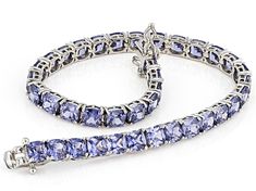 Bella Luce® Esotica™ tanzanite diamond simulant 27.54ctw square cushion, platinum over sterling silver tennis bracelet. Measures approximately 7.25" - 8" L x 0.19" W and has a hidden box clasp closure. Fine Jewelry Tanzanite Cushion Cut, Cushion Cut Tanzanite Jewelry In White Gold, Fine Jewelry With Cushion Cut Tanzanite, Fine Jewelry Rectangular Tanzanite, Cushion Cut Tanzanite Jewelry Gift, Cushion Cut Tanzanite Jewelry For Gifts, Cushion Cut Tanzanite Jewelry As A Gift, Fine Jewelry Tanzanite Bracelets For Gift, Classic Rectangular Tanzanite Jewelry