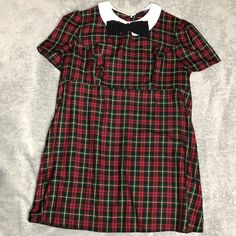 Women’s Plus Size Fitted Plaid Dress Bow & Collar Zip Up With Button Neck Closure Short Sleeve Never Worn Has A Hole In The Seem At The Hip. Can Be Repaired Ireland Size 20 Us Size 16 Pit To Pit- 22” Waist-20 1/2” Length-34” D-2 Casual Buttoned School Dress, Casual School Dress With Buttons, Casual Mini Dress For School, Retro Short Sleeve School Dresses, Short Sleeve Mini Dress For Holiday, Fitted Short Sleeve Mini Dress For Holiday, Casual Mini Dress For Holiday, Casual Plaid Dress With Short Sleeves And Buttons, Preppy Short Sleeve Dresses For School