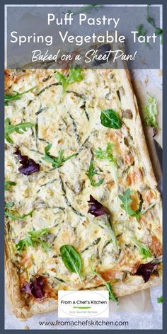 a square vegetable tart with spinach and cheese on top, sitting on a white surface