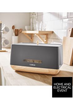 a toaster sitting on top of a wooden counter