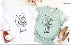 🌿 Celebrate in Style with Our Boho-Themed Bachelorette Party Shirts! 🌿 Get ready to make unforgettable memories with our Boho Bride & Bridesmaid Tees. Perfect for the bride-to-be who loves nature and a touch of bohemian flair, these shirts are a must-have for any bachelorette bash, whether in the mountains, the desert, or under the stars! Why You'll Love Our Shirts: Unique Bohemian Designs: Featuring charming boho themes inspired by nature, mountains, and deserts, these shirts capture the free-spirited vibe of your bridal party. For Every Bride and Her Tribe: Choose from a variety of designs tailored for the Bride, Bridesmaids, and the entire bridal crew. Celebrate the leading lady and her special entourage with style. Customizable and Personal: Add a personal touch to make each shirt ex Boho Bachelorette Party Shirts, Bride To Be Shirts, Bridesmaid Shirt, Desert Boho, Bachelorette Party Shirt, Brides Babes, Bachelorette Party Planning, Mountain Nature, Bohemian Bridal