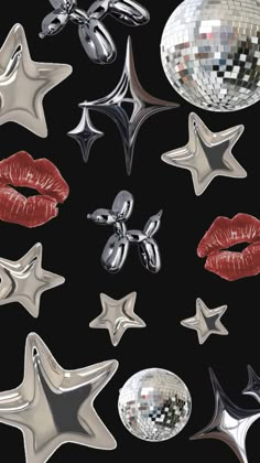 some shiny objects are arranged in the shape of stars and kiss - like lips on a black background