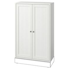 a tall white cabinet with two doors