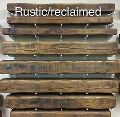 some wooden planks are stacked up against a wall with the words rustic / reclaimed on them