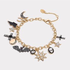 Unveil a touch of eerie enchantment with our Halloween Charm Bracelet. This macabre masterpiece, clad in 18K gold on brass, conjures visions of a spine-chilling soirée. Adorned with a dripping oil charm, it's as if the very essence of a haunted house has been captured. Sparkling cubic zirconia stones add a ghostly glow, casting a bewitching spell under the moonlight. A perfect accessory for those who revel in the gothic and grotesque. Dare to be different and let your Halloween spirit shine. DET Charm Bracelet Tattoo, Halloween Charm Bracelet, Xoxo Jewelry, Under The Moonlight, Tattoo Bracelet, A Haunted House, Halloween Charms, Brass Bracelet, The Gothic