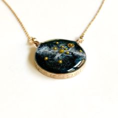 "A beautiful, handmade reminder of our place in the universe and connection to each other.  This Solar System Necklace has golden glass microbeads carefully hand placed to create our sun and planets on a backdrop of the shimmering milky way galaxy made of mica. The scene floats in a sparkling inky resin and is covered with a clear dome, adding dimensions and depth to this celestial scene.  Stamped with the word STARDUST, the bezel is hand cast from your choice of sterling silver or bronze and ha Virgo Jewelry, Solar System Necklace, Virgo Necklace, Planet Necklace, Galaxy Necklace, Astrology Necklace, Zodiac Sign Necklace, Constellation Necklace, Jewelry Tags