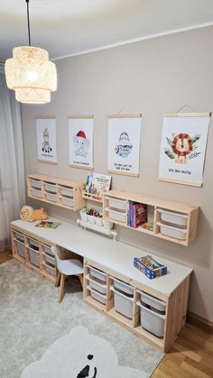 a child's room with toys and artwork on the wall