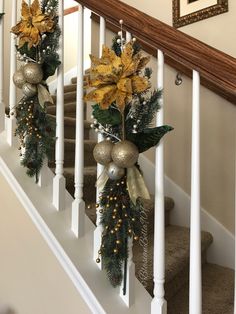 christmas decorations are hanging on the banisters