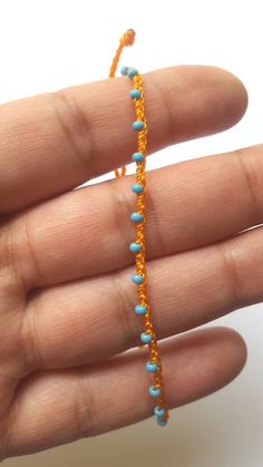 "♡Listing is for one dainty seed bead bracelet or anklet as featured and your choice of card♡ Perfect for everyday wear. Super dainty and minimalist look. Great way to add a little color to any outfit. Makes a very dainty stacking bracelet too. *Featured: Cord color-Tangerine Beads- Sky Blue Closure- A. With Beads *Material: Item is made with sturdy nylon cord. The cord resembles silk and color will not fade away. Tiny glass seed beads are carefully hand braided as the highlight of this item. *C Blue Tiny Beads Anklet For Gift, Blue Anklet With Tiny Beads For Gift, Handmade Turquoise Anklet Bracelet, Blue Beaded Chain Anklets As Gift, Blue Beaded Chain Anklets For Gift, Blue Anklets With Tiny Beads, Minimalist Handmade Anklets With Round Beads, Minimalist Handmade Beaded Anklets, Crochet Micro Braids