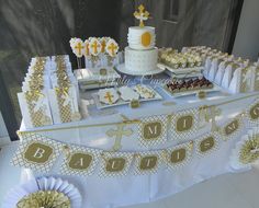 a table topped with lots of cakes and desserts